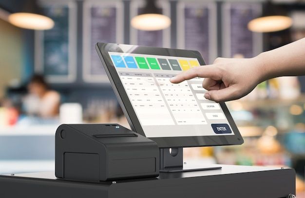 Premium Photo _ Human hand working with 3d rendering cashier machine